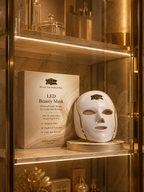 LED beauty mask on a shelf with packaging in a decorative setting